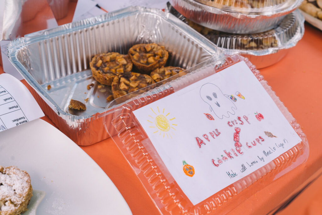 Nora's Apple Crisp Cookie Cups in a to-go tin with her hand-drawn label.